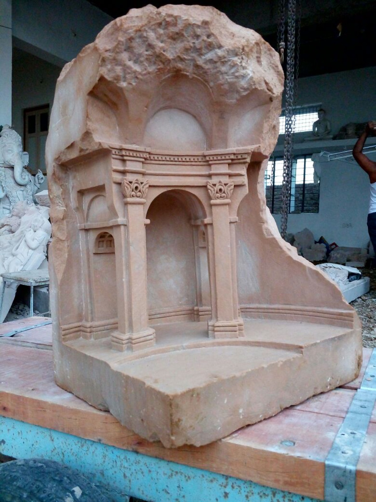 Arched niche with pilasters, carved out of a rough sandstone block in the workshop